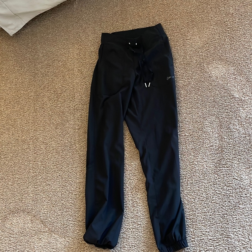 Black scrubs - worn once. Some minor pilling from the wash. Brand is +FIT